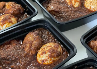 A group of trays filled with meat and eggs in an Ethiopian Flavors cooking class