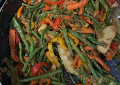 Green beans, carrots and peppers in a pan at our Ethiopian Flavors Cooking Class