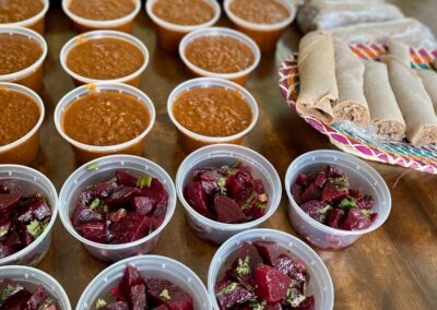 Several bowls of food on a table during our Ethiopian Flavors Cooking Class