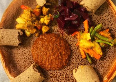 A plate of food on a table during our Ethiopian Flavors Cooking Class