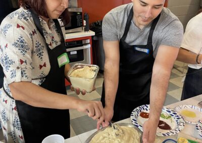 Two people preparing Lebanese Cooking Class with Jihan in a kitchen.