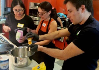 A group of people preparing food in a Venezuelan Cuisine cooking class